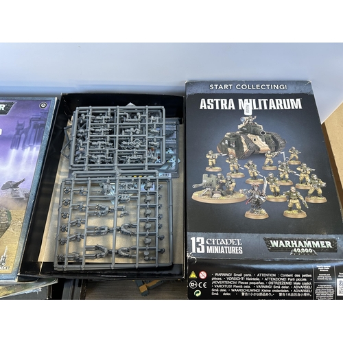 404 - A collection of Warhammer model making kits and accessories to include Astra Militarum Leman Russ Ba... 