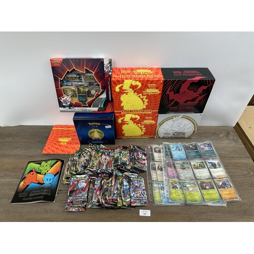 421 - A collection of Pokémon trading cards and accessories to include Dragonite VSTAR deck holder box, Sw... 