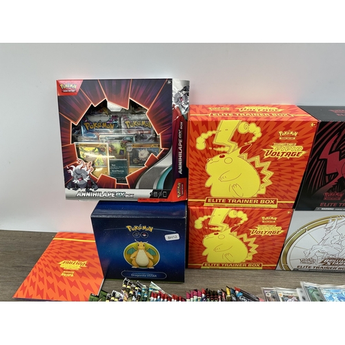 421 - A collection of Pokémon trading cards and accessories to include Dragonite VSTAR deck holder box, Sw... 