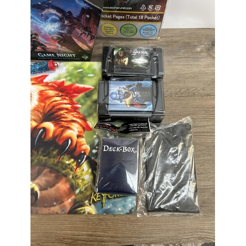 422 - A collection of Magic The Gathering trading cards and accessories to include deck builders tool kit,... 