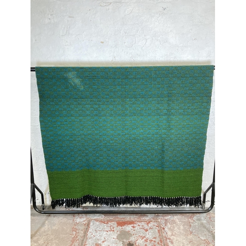 464 - A mid 20th century green and blue hand woven bed throw