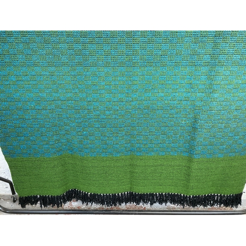 464 - A mid 20th century green and blue hand woven bed throw