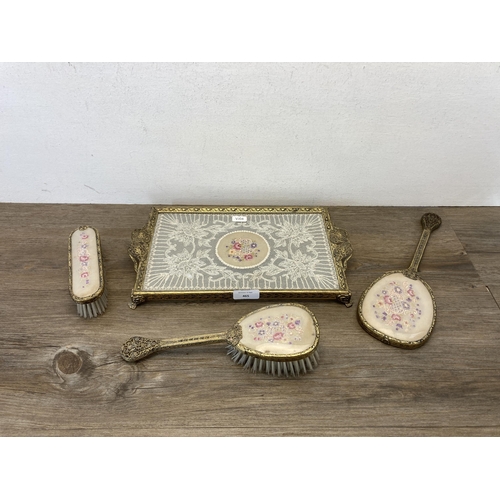 465 - A mid 20th century four piece petit point dressing table set