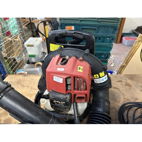 763A - Two items, one B&Q MGT600 240v electric grass trimmer and one Bu-Ko 6500 backpack petrol leaf blower