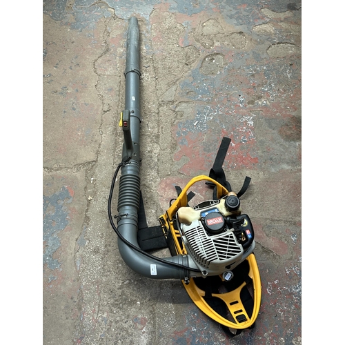 767 - A Ryobi RBL26BP backpack petrol leaf blower