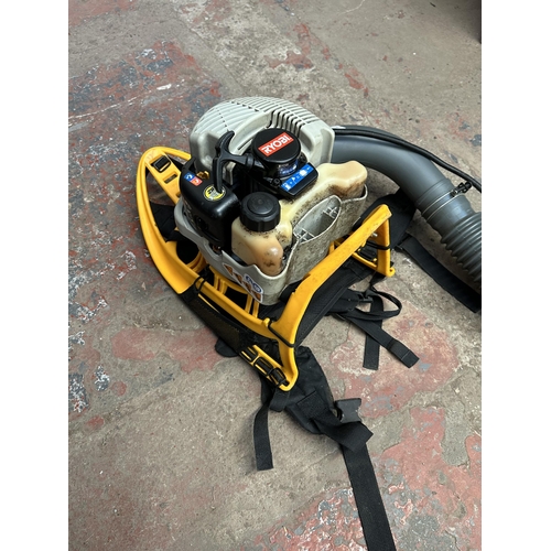 767 - A Ryobi RBL26BP backpack petrol leaf blower