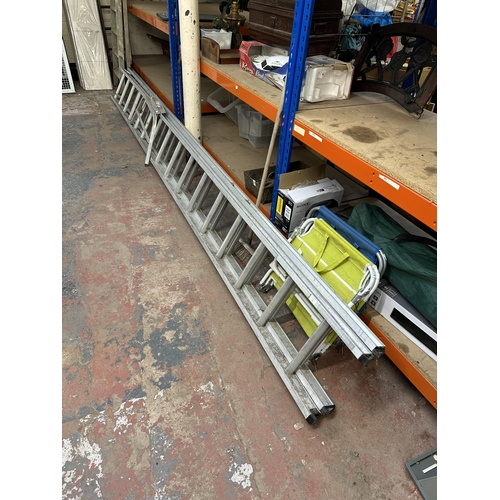 770 - A set of aluminium extending ladders