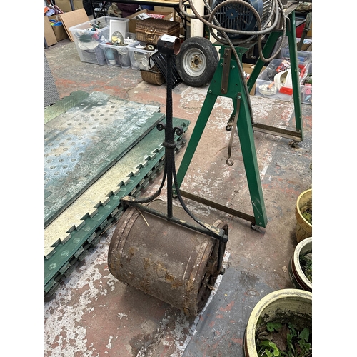 809 - An antique cast iron garden roller - approx. 113cm high