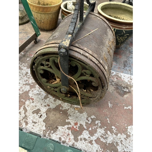 809 - An antique cast iron garden roller - approx. 113cm high