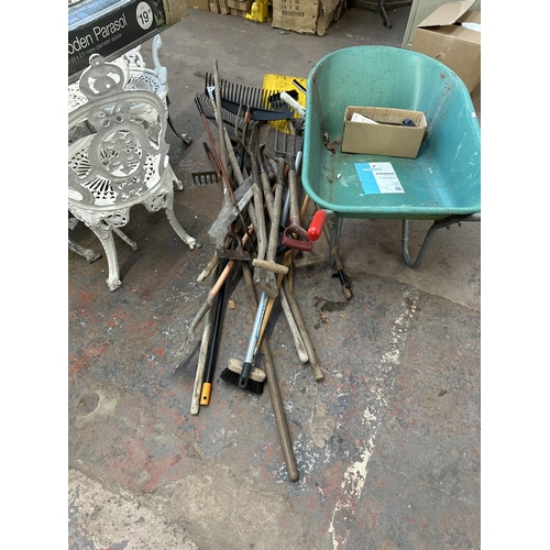 817 - A quantity of garden hand tools to include Focus 85L wheelbarrow etc.