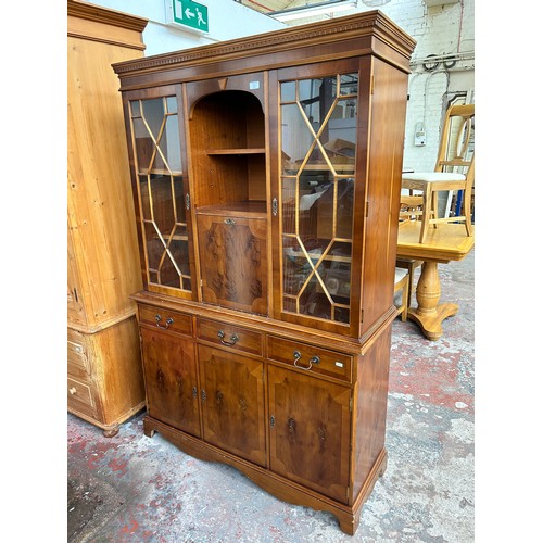 75C - A Georgian style yew wood astral glazed bureau bookcase