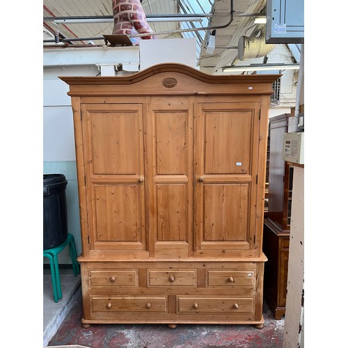 75D - A Victorian style pine triple wardrobe - approx. 219cm high x 164cm wide x 60cm deep