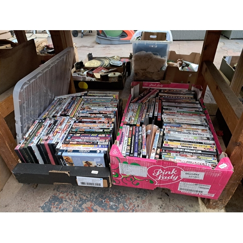 819 - Four boxes containing adult DVDs and magazines