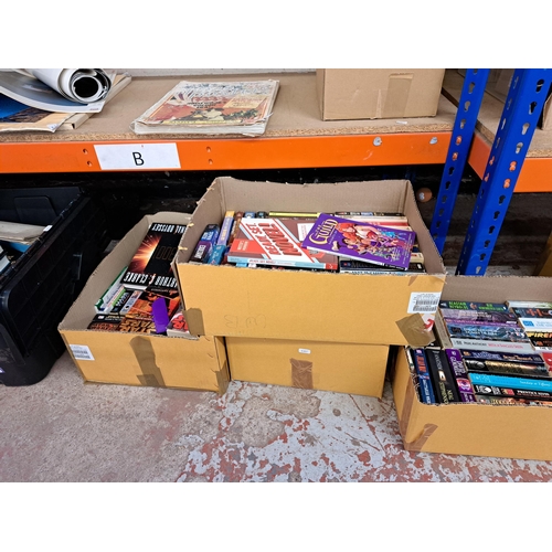 824 - Twelve boxes containing a large collection of mainly mass market paper back fantasy books to include... 