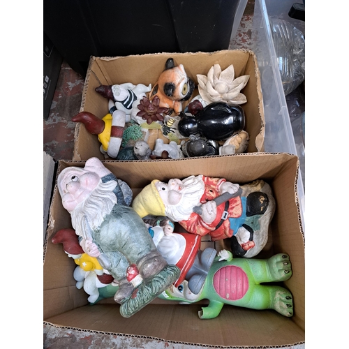 828 - Four boxes containing house clearance items to include garden ornaments, kitchenware etc.