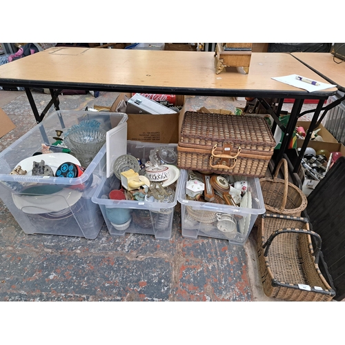 829 - Three boxes and three wicker baskets containing house clearance items to include two models of Mow C... 