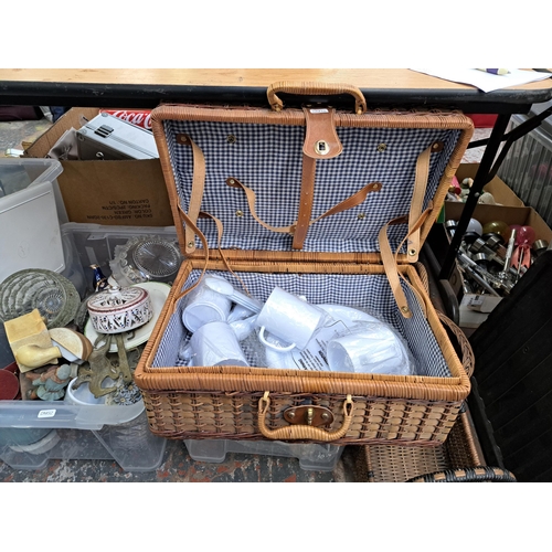 829 - Three boxes and three wicker baskets containing house clearance items to include two models of Mow C... 