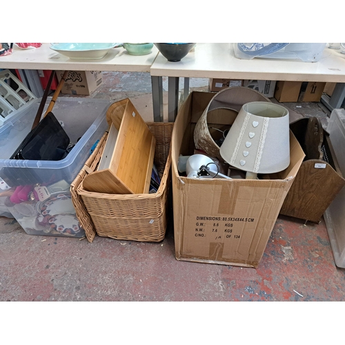 850 - Five boxes containing oak and rattan magazine rack, bamboo bread bin, cutlery etc.