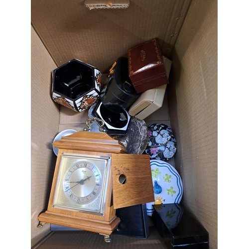 869 - Two boxes and one suitcase containing quartz mantel clock, ceramics, artificial flowers etc.