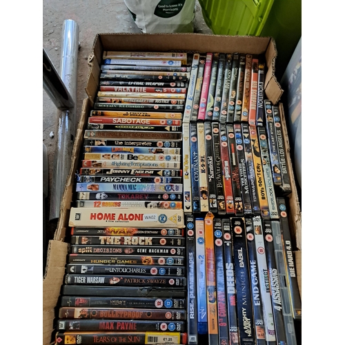 871 - Three boxes containing a large collection of DVDs