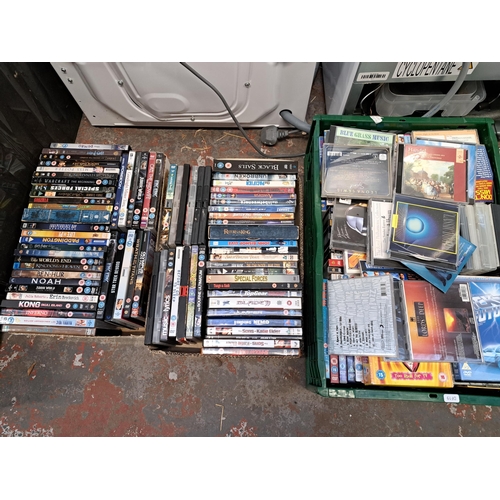 875 - Ten boxes containing a large collection of DVDs and CDs