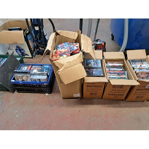 876 - Seven boxes containing a large collection of DVDs