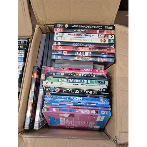 876 - Seven boxes containing a large collection of DVDs