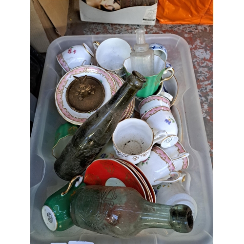 879 - A box containing ceramics and glassware to include vintage glass beer bottles, Royal Grafton tea cup... 