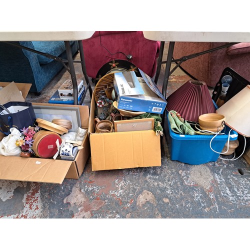 864 - Five boxes and one brown leather suitcase containing treenware, ceramics, cutlery, boxed Black & Dec... 