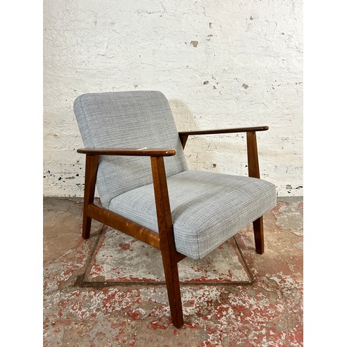 135 - An IKEA Ekenaset stained beech and grey fabric upholstered armchair