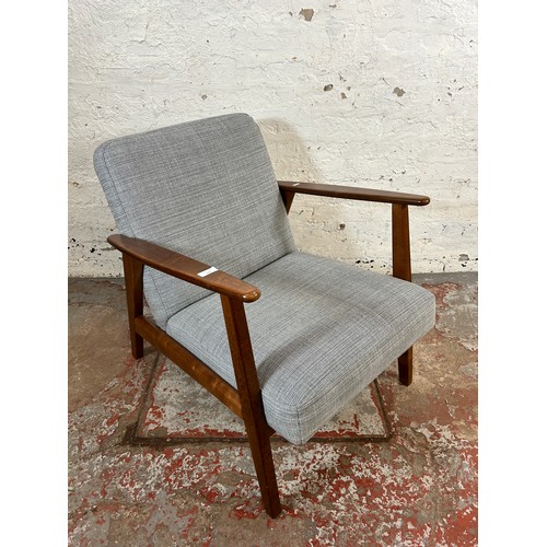 135 - An IKEA Ekenaset stained beech and grey fabric upholstered armchair