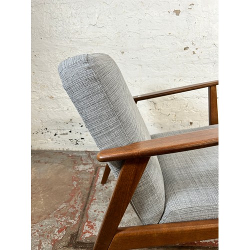 135 - An IKEA Ekenaset stained beech and grey fabric upholstered armchair