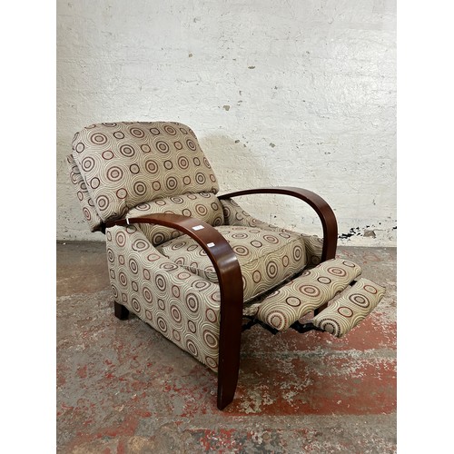 189A - A modern bentwood and fabric upholstered reclining armchair