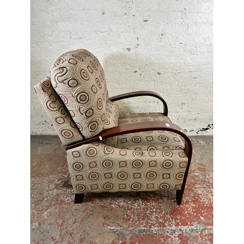 189A - A modern bentwood and fabric upholstered reclining armchair