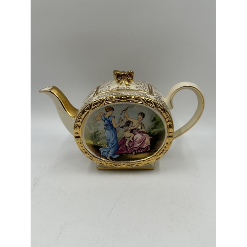 309E - A Sadler No. 1760 Enchanting Cherub barrel three piece tea set