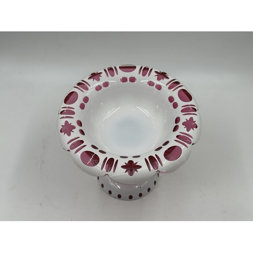 316 - A 19th century Bohemian white overlay and cranberry glass circular pedestal bowl - approx. 15cm high... 