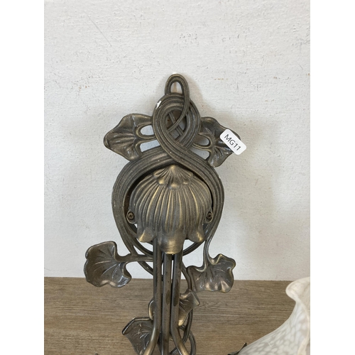 481 - An Art Nouveau style brass effect three branch wall light with frosted glass bell flower shaped shad... 