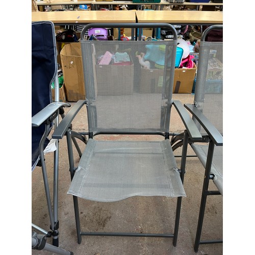 813 - Four grey metal folding garden chairs