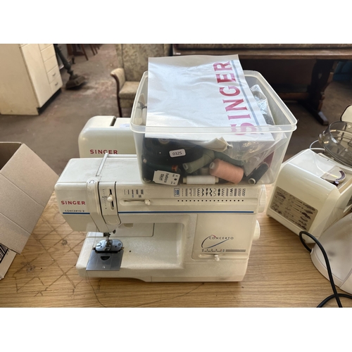 699 - A cased Singer Concerto 2 electric sewing machine with foot pedal, accessories and instruction manua... 