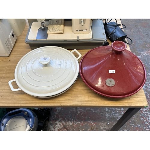 708 - Two items, one Emile Henry Tagine and one enamelled cast iron shallow casserole