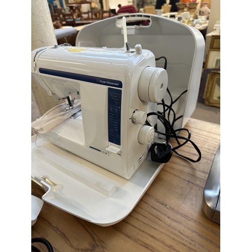 710 - A cased Frister + Rossmann Cub SP compact electric sewing machine with foot pedal