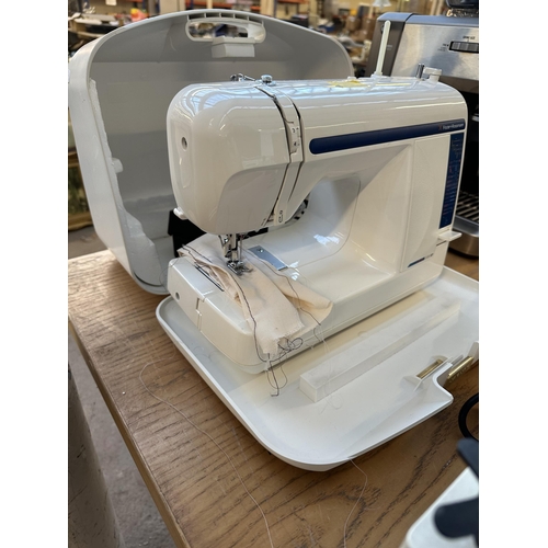 710 - A cased Frister + Rossmann Cub SP compact electric sewing machine with foot pedal