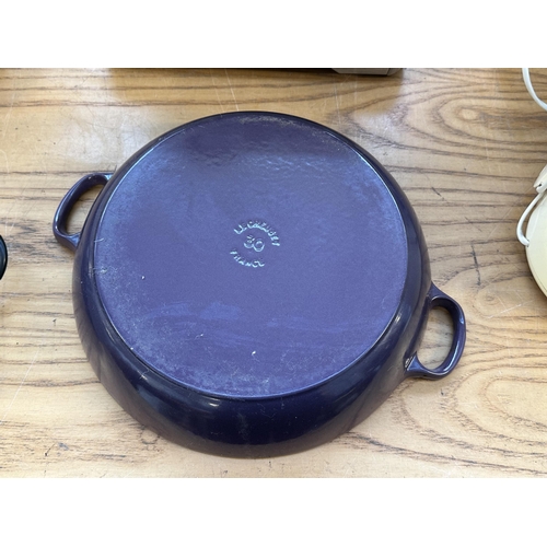 713 - A Le Creuset Ultra Violet enamelled cast iron 30cm shallow casserole