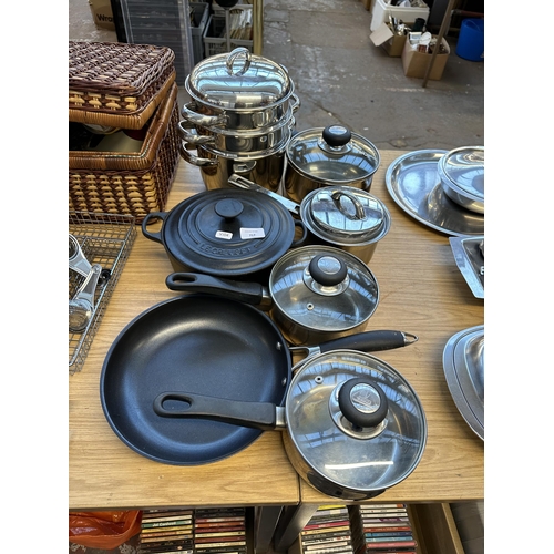 717 - A collection of good quality cookware to include Le Creuset 20cm casserole, John Lewis non-stick fry... 