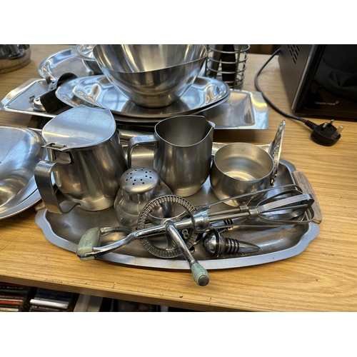 718 - A collection of stainless steel serveware to include Old Hall, Alfra etc.