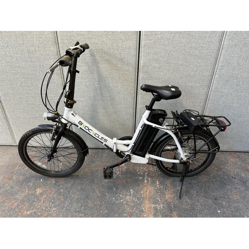 743 - A Byocycles folding electric bike with battery charger