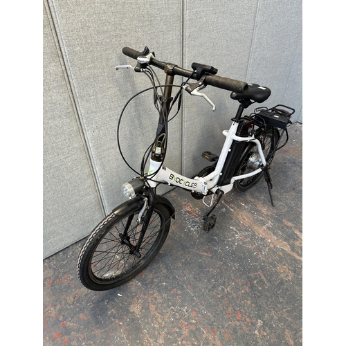 743 - A Byocycles folding electric bike with battery charger