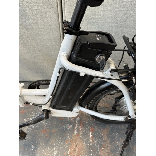 743 - A Byocycles folding electric bike with battery charger