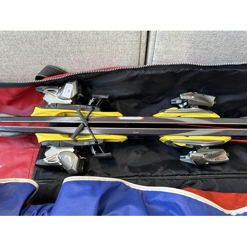 745 - Two cased pairs of skis, one Salomon 900S with pair of Scott Edge poles and one Dynastar