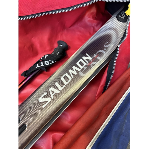 745 - Two cased pairs of skis, one Salomon 900S with pair of Scott Edge poles and one Dynastar